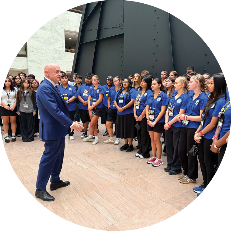 Sen. Mark Kelly speaks with delegates.